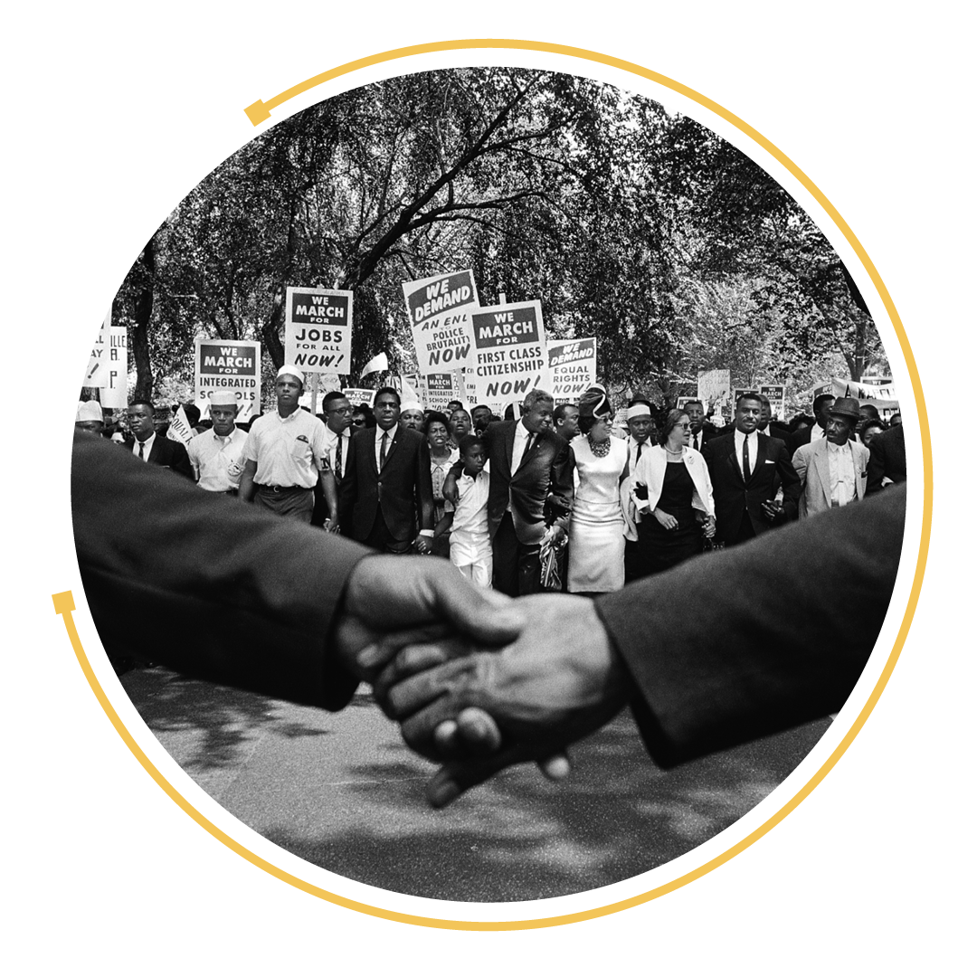 Two people shaking hands in front of the March on Washington